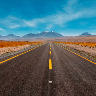 open road with mountain in the distance